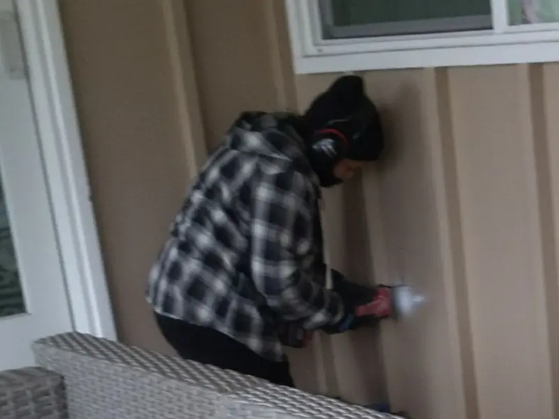 Professional electrician installing an exterior outlet in Leicester